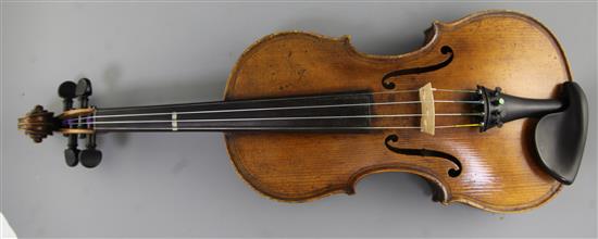 A violin bearing label for Maggini and date 1616, 14.5in., length overall 23.5in.